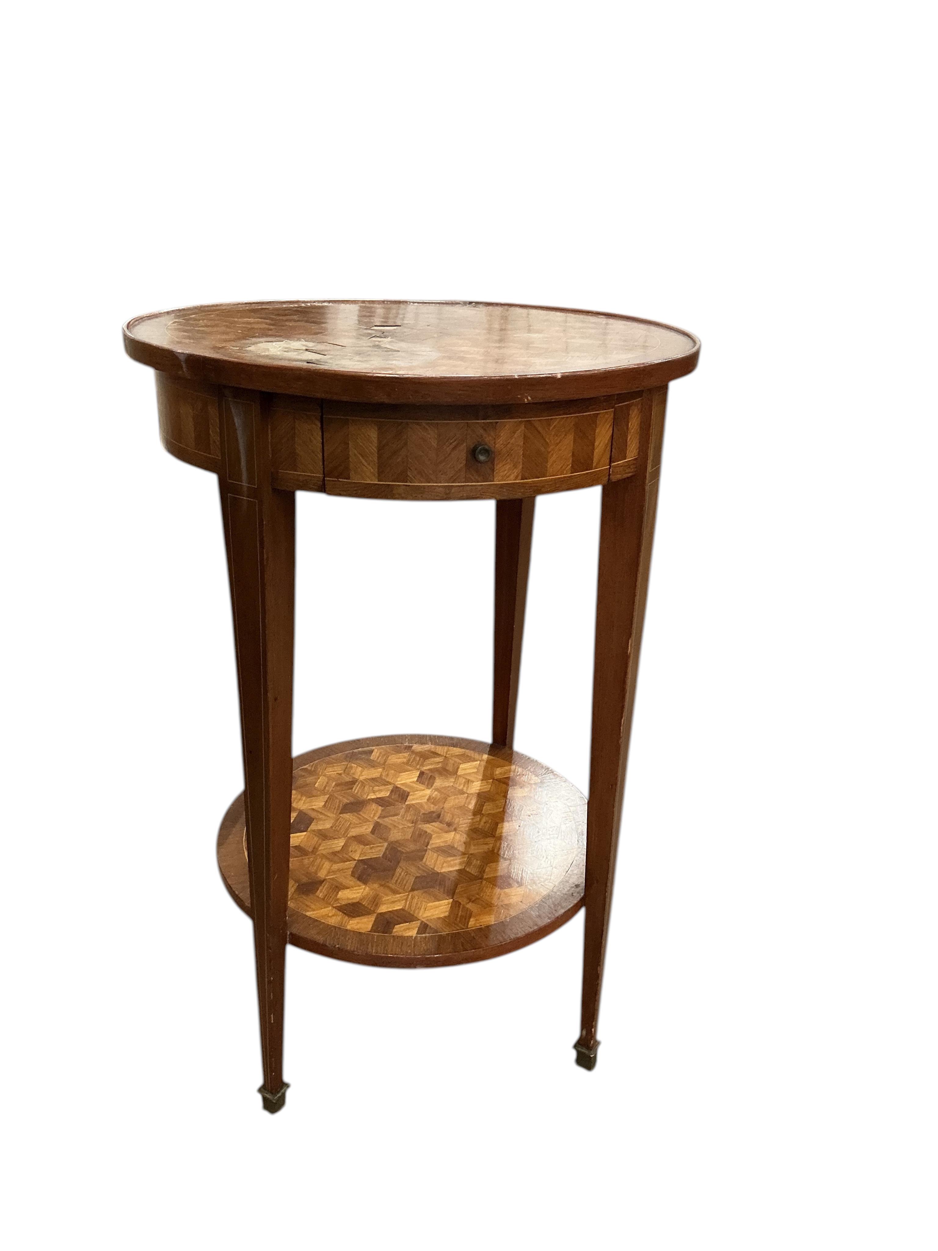 A French transitional style circular parquetry inlaid two tier table, diameter 50cm, height 75cm